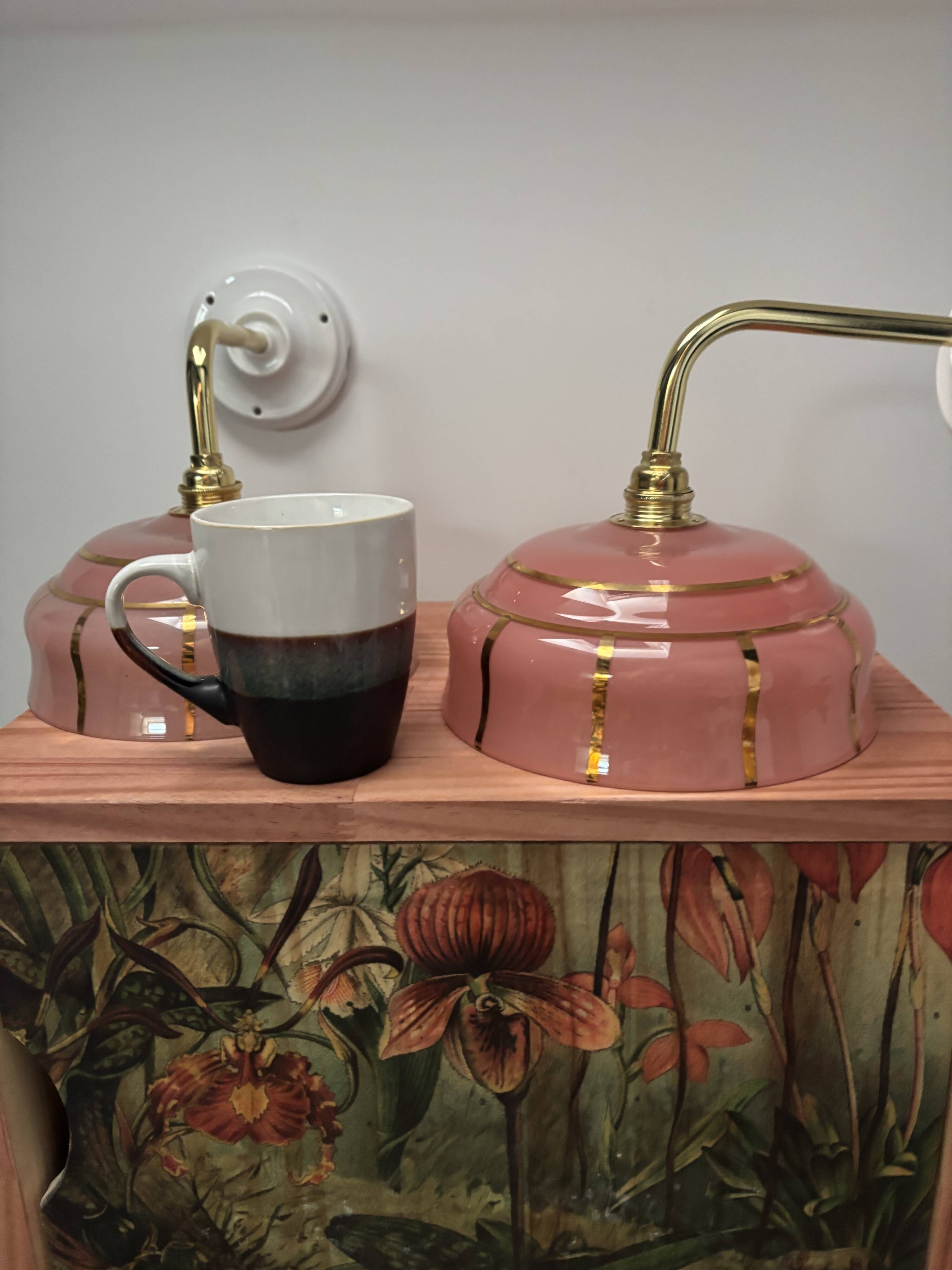 Pair of white ceramic wall lights with pink glass