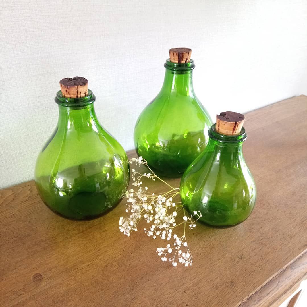 3 green glass bottles