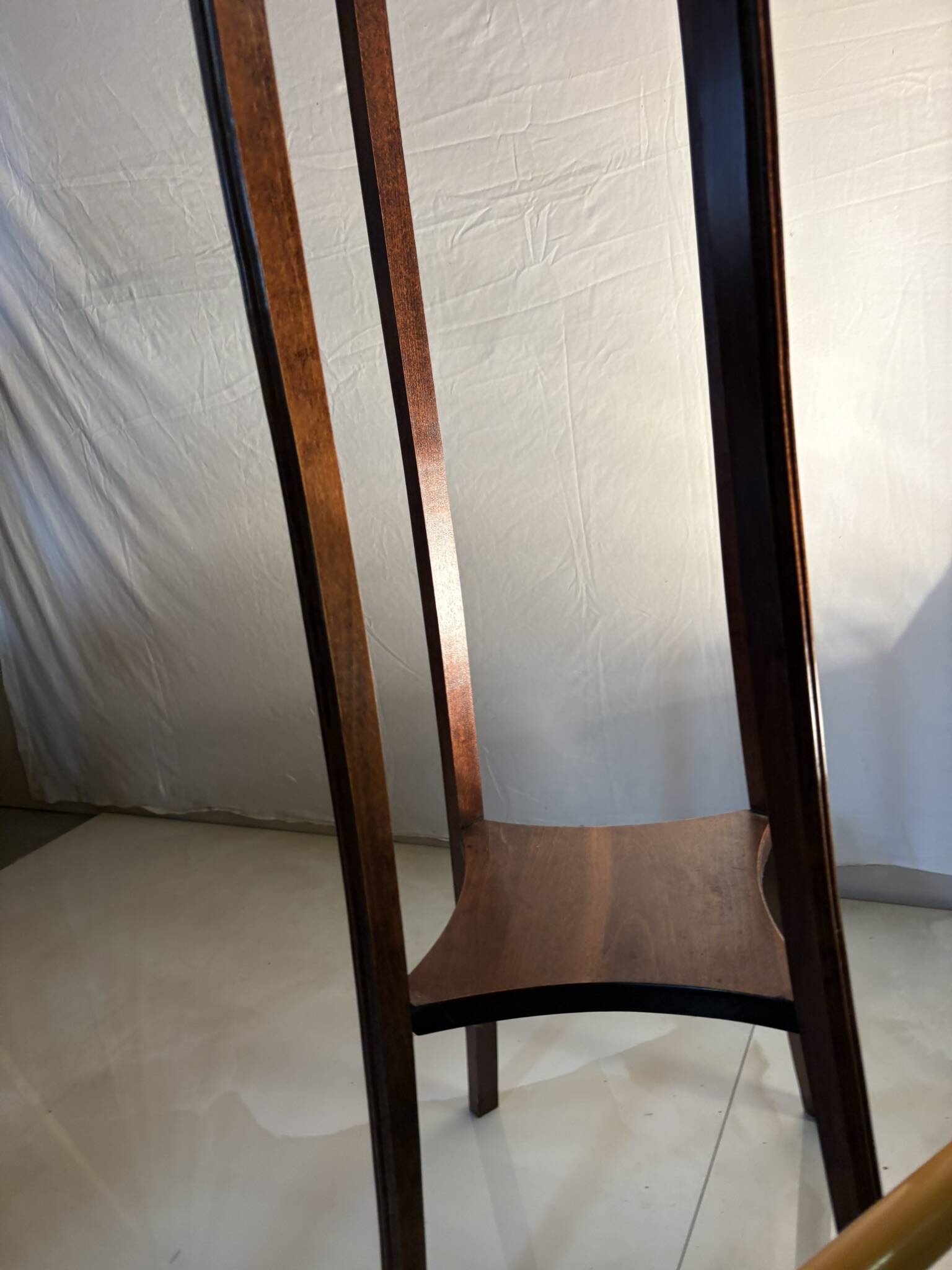 Vintage dark wood side table with curved base