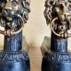 Pair of antique fire dogs with lion heads - patinated cast iron