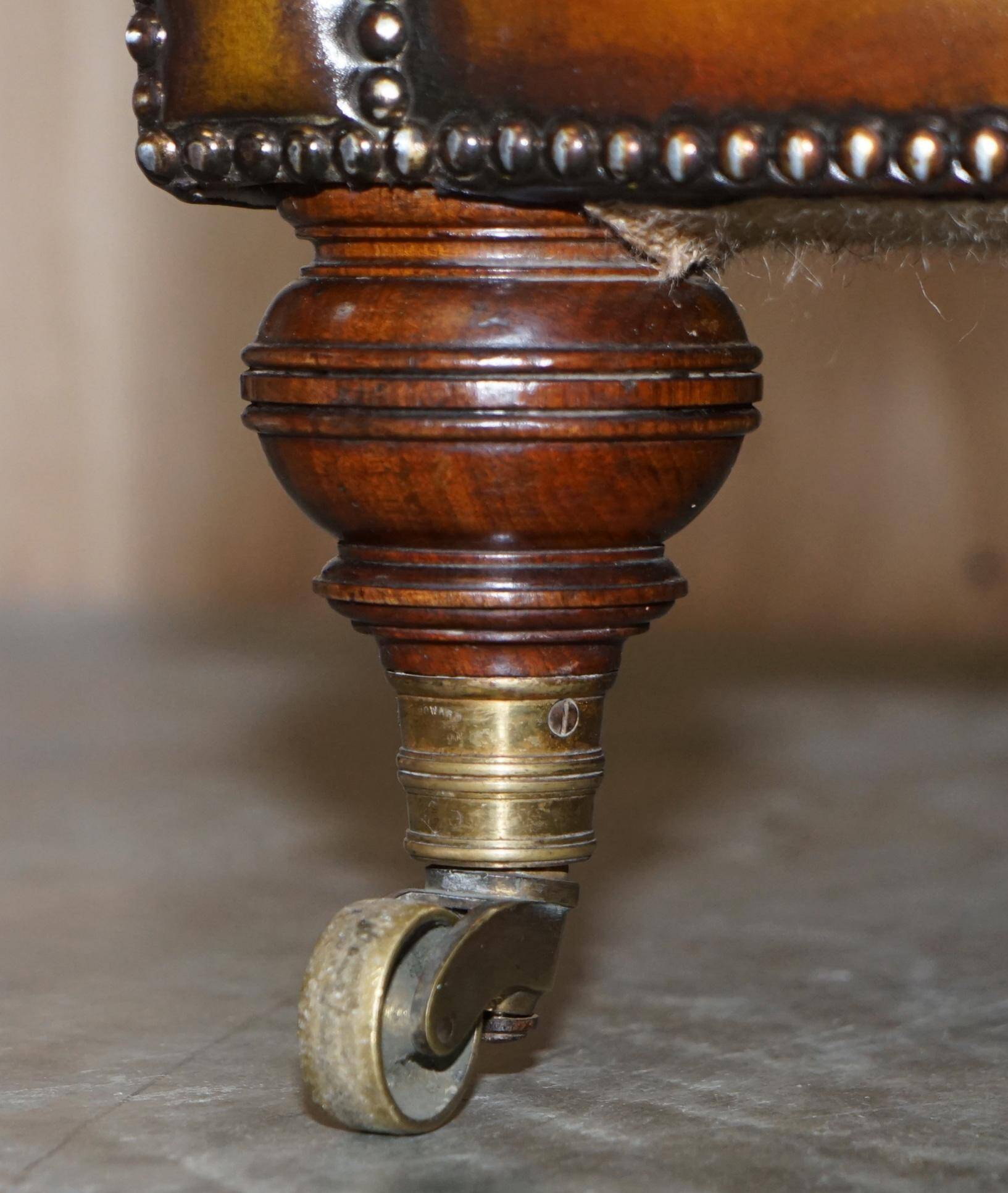 Pair of leather Chesterfield sofas by Howard & Sons