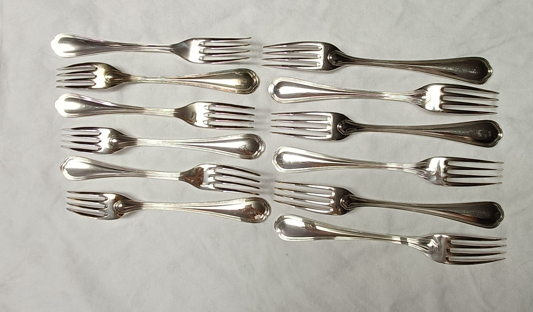 12 silver metal table forks from Christofle model "Spatours"