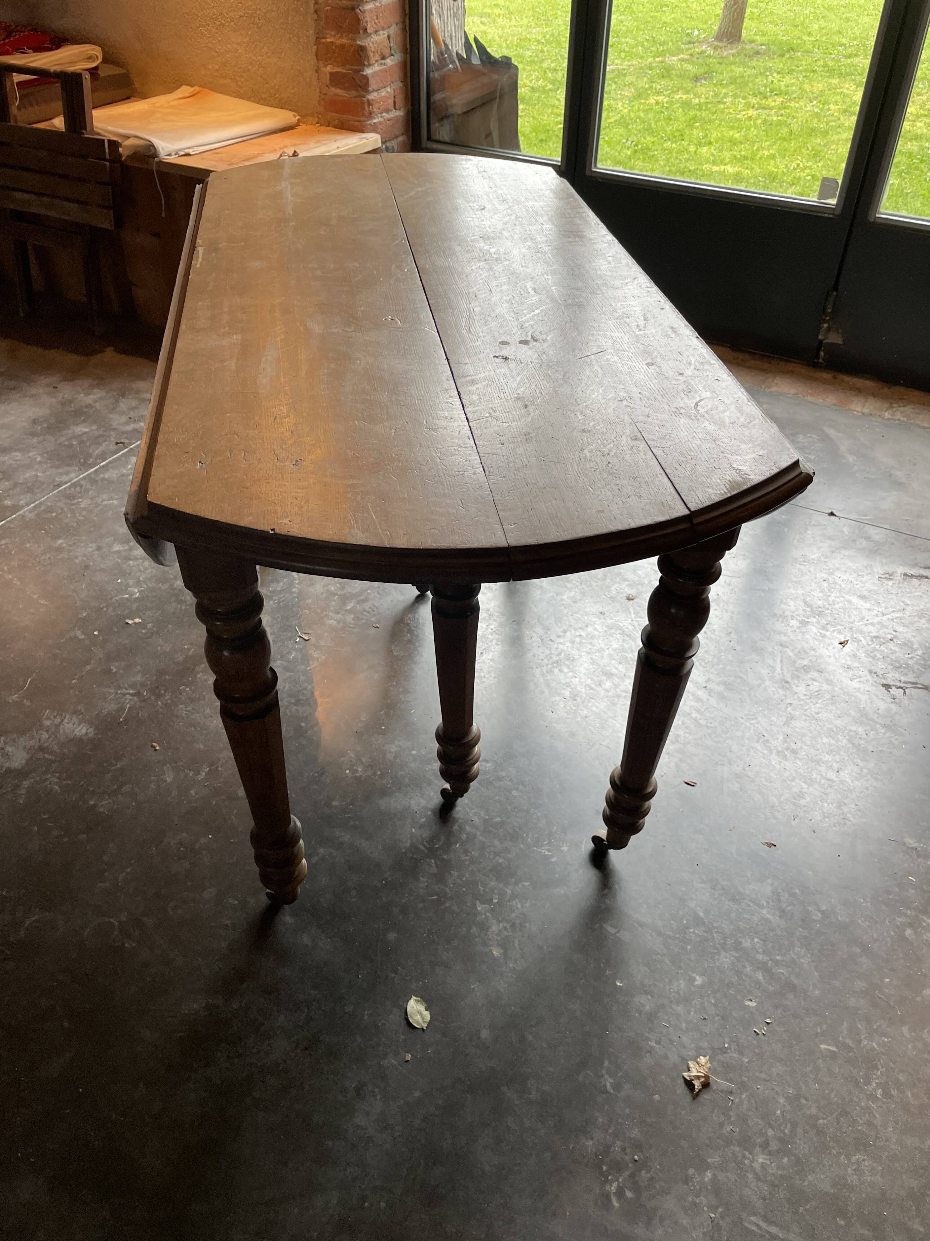 Old wooden table with folding flaps