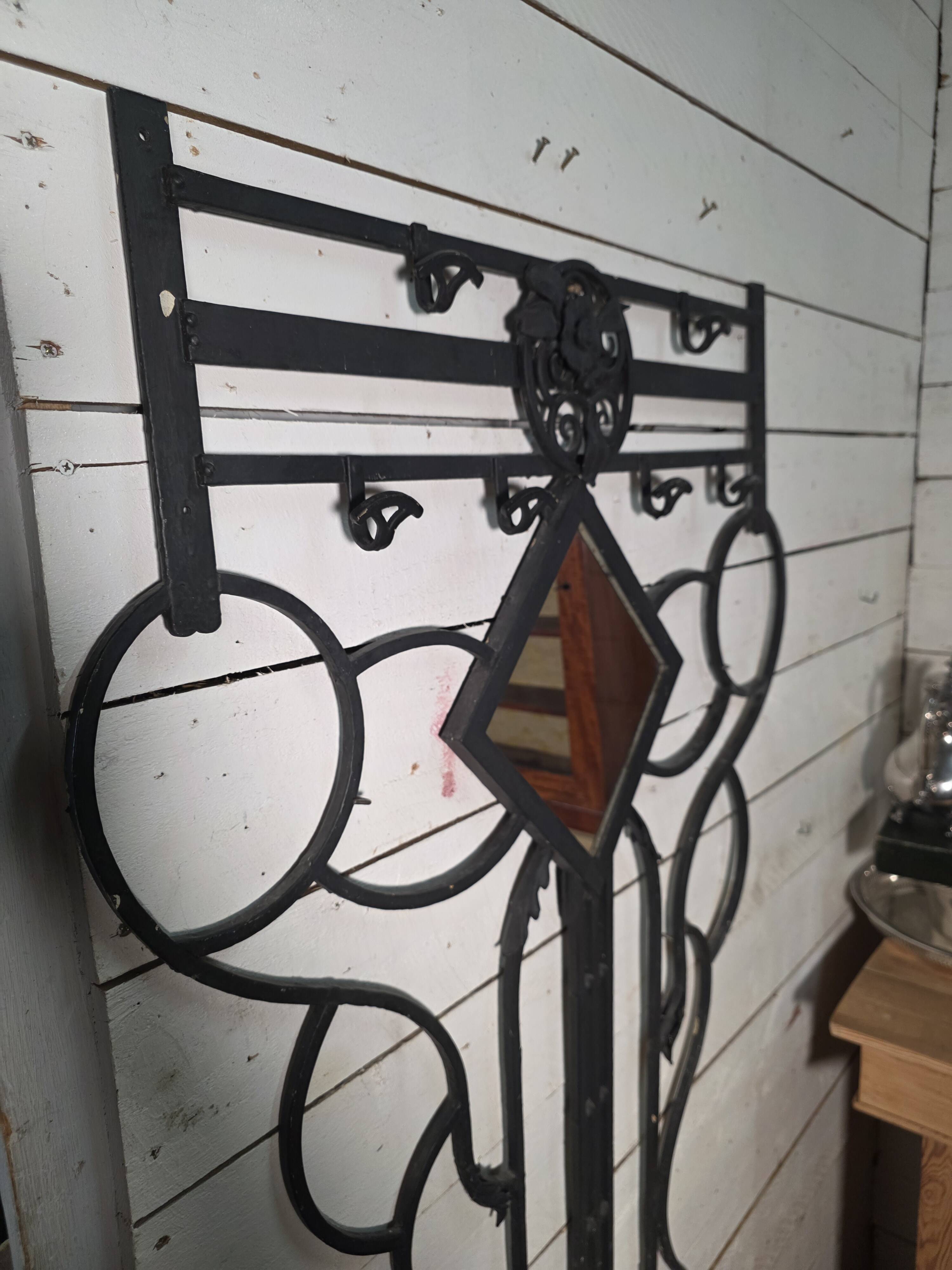 Art Deco coat rack wardrobe in wrought iron from the 1930s.