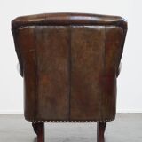 Classic grained cognac colored cowhide leather Chesterfield armchair