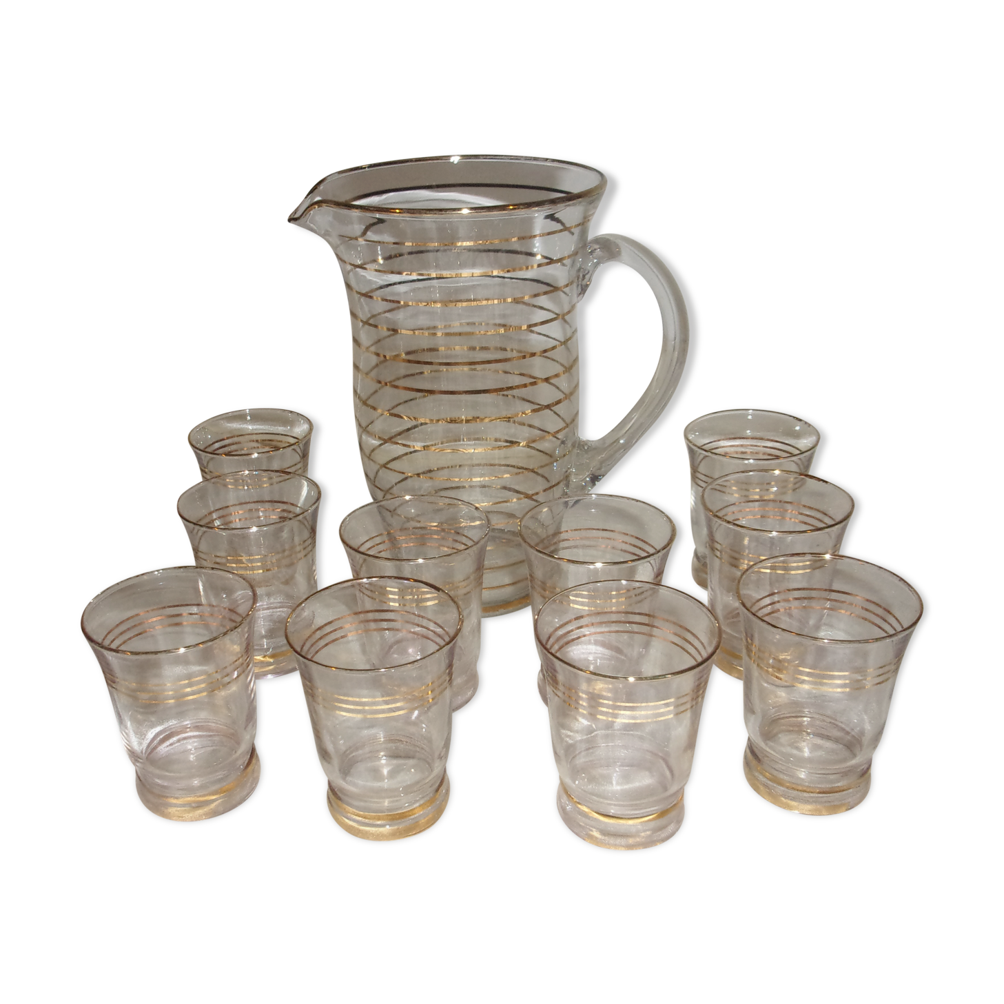 Service in glass pitcher and 10 glasses