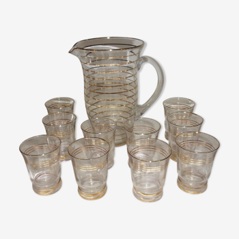 Service in glass pitcher and 10 glasses