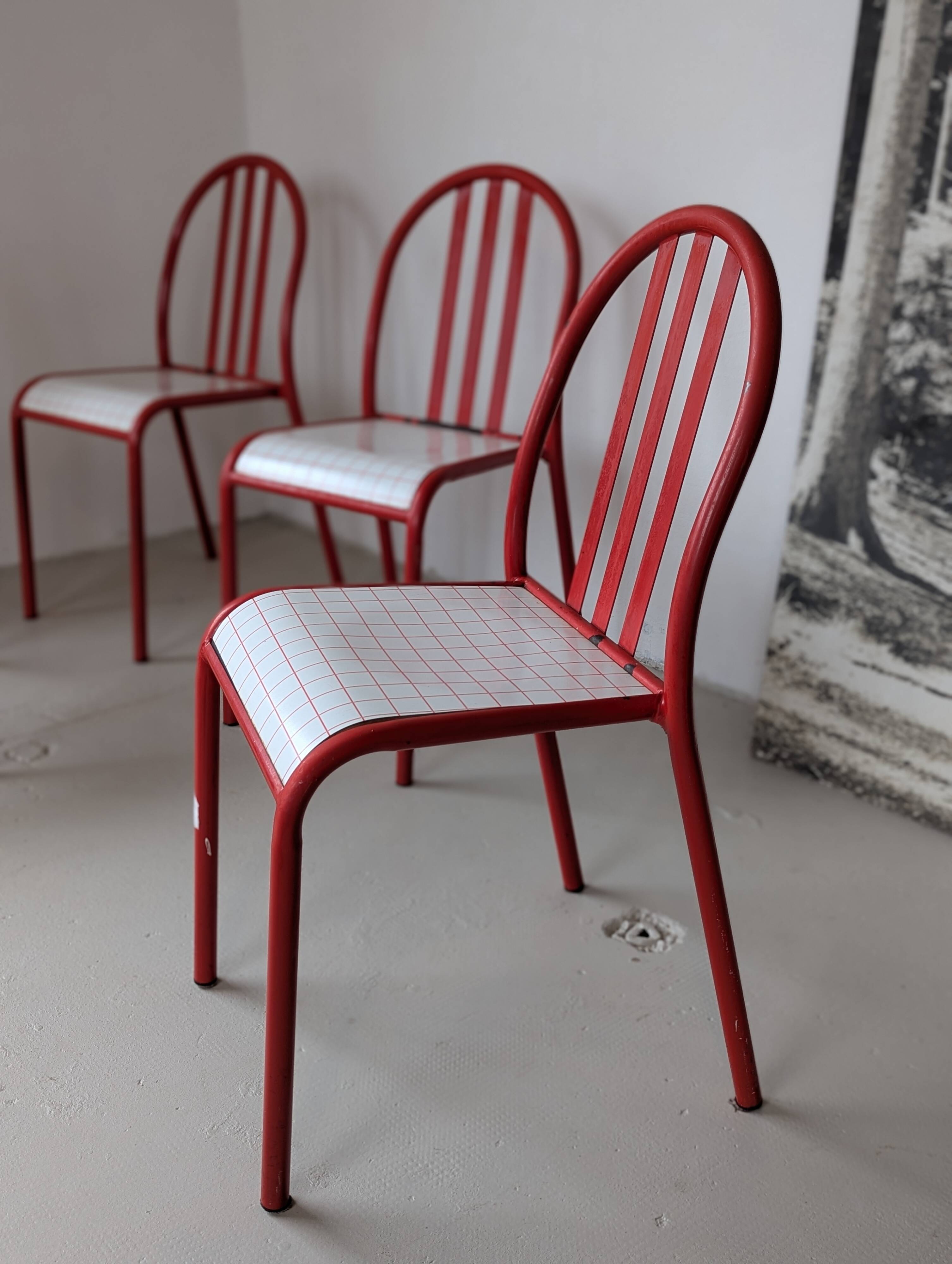 Set of 4 modernist red metal chairs