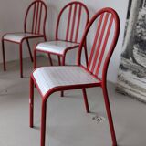 Set of 4 modernist red metal chairs