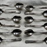 Set of 12 small silver-plated metal spoons in Art Nouveau style.