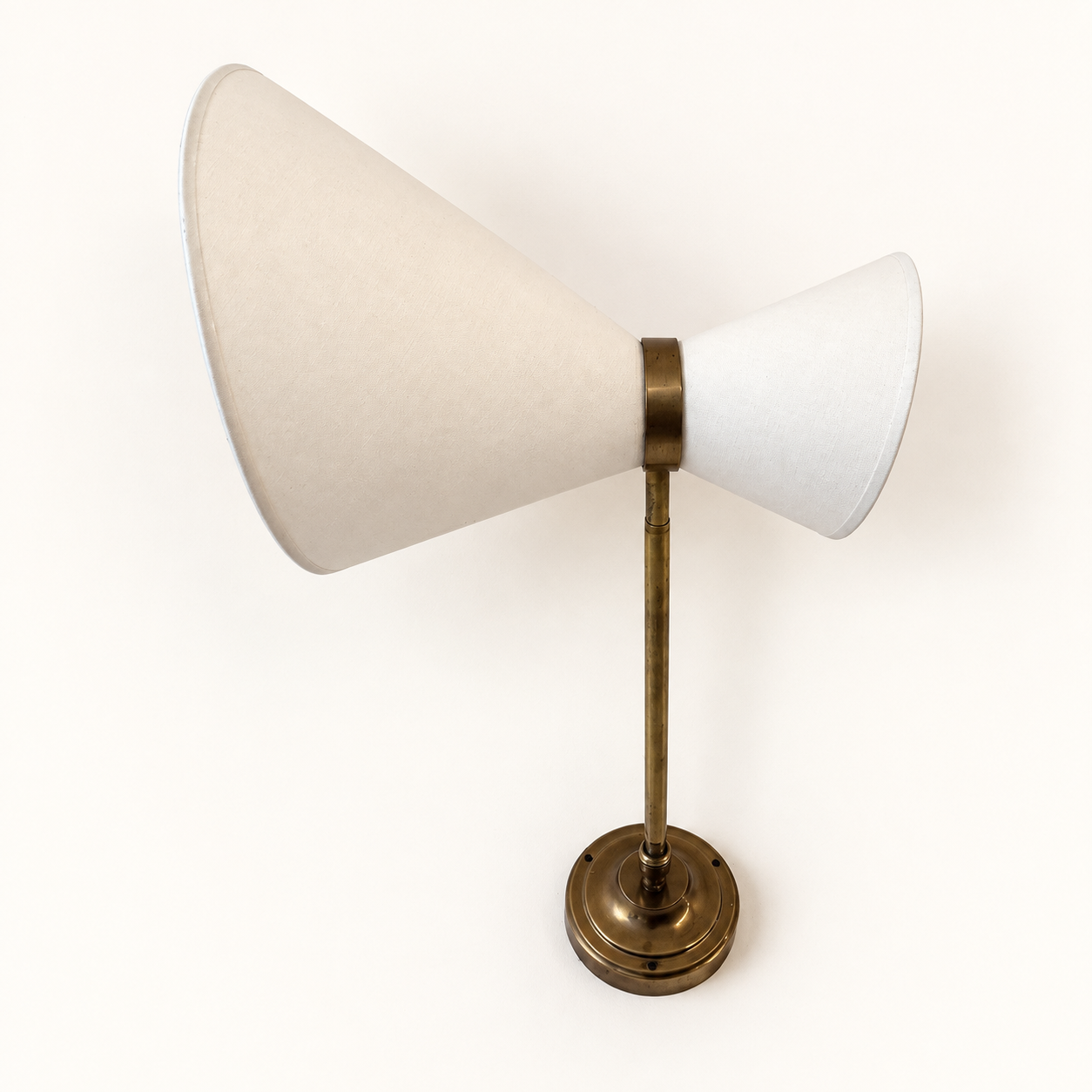 Extendable wall light in the style of Maison Lunel.