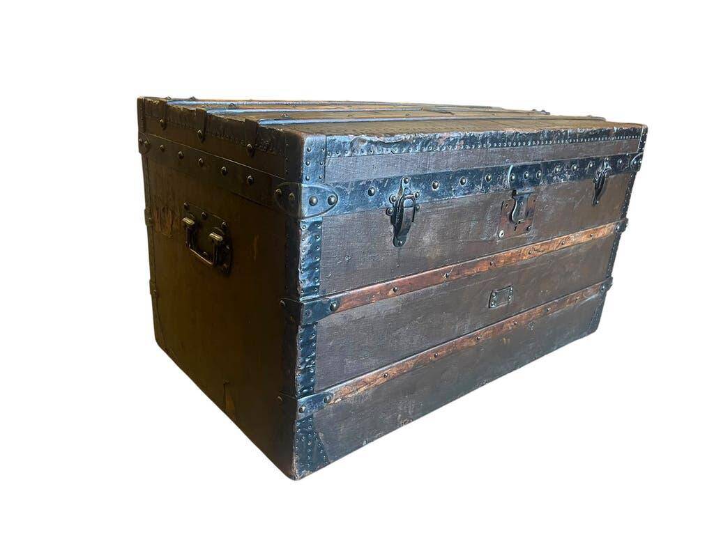 Vintage wooden coffee table with iron fittings.
