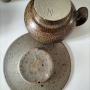 Set of 8 stoneware cups and a mug, shades of beige.
