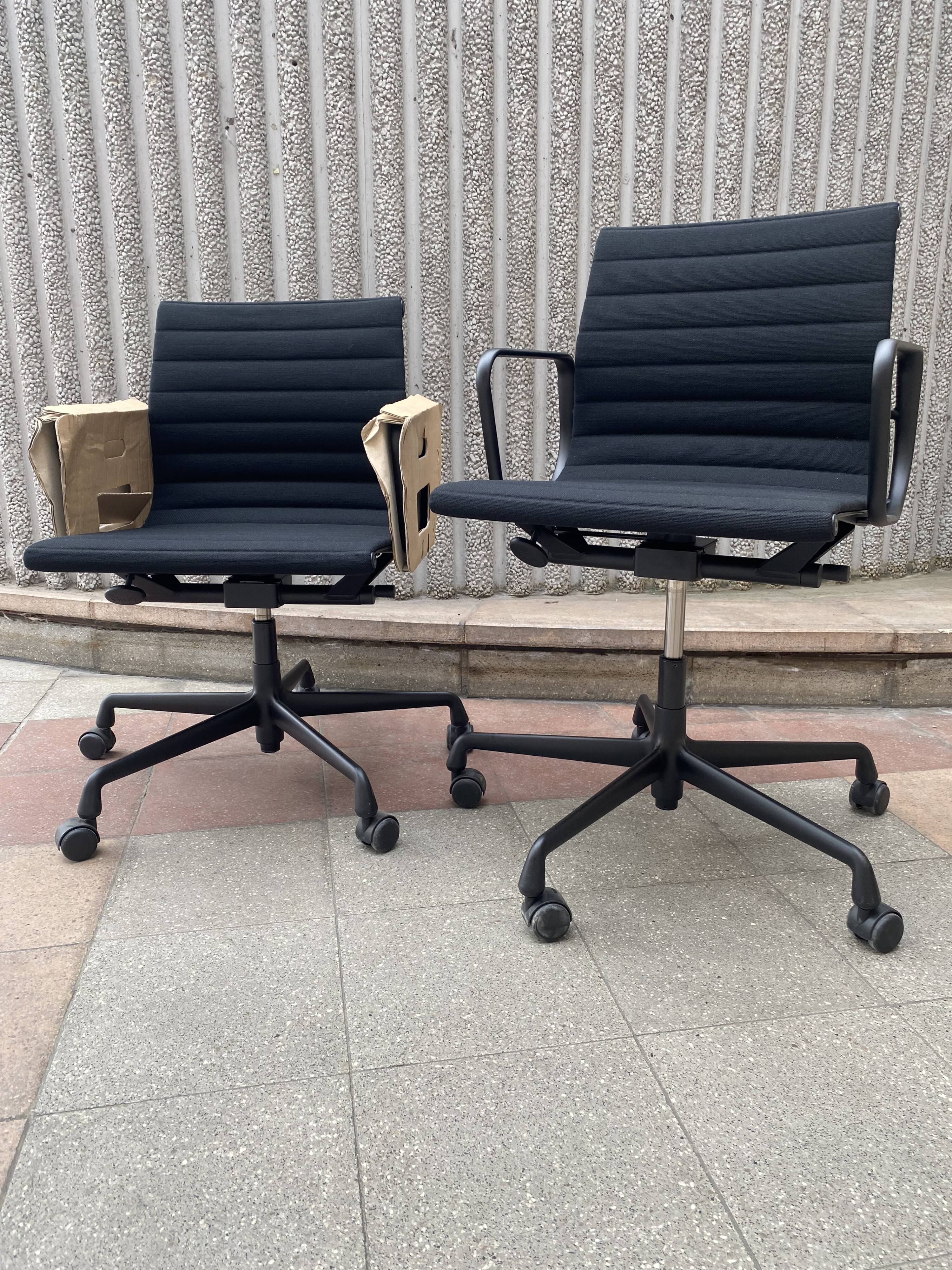 2 Charles Eames EA118 armchairs