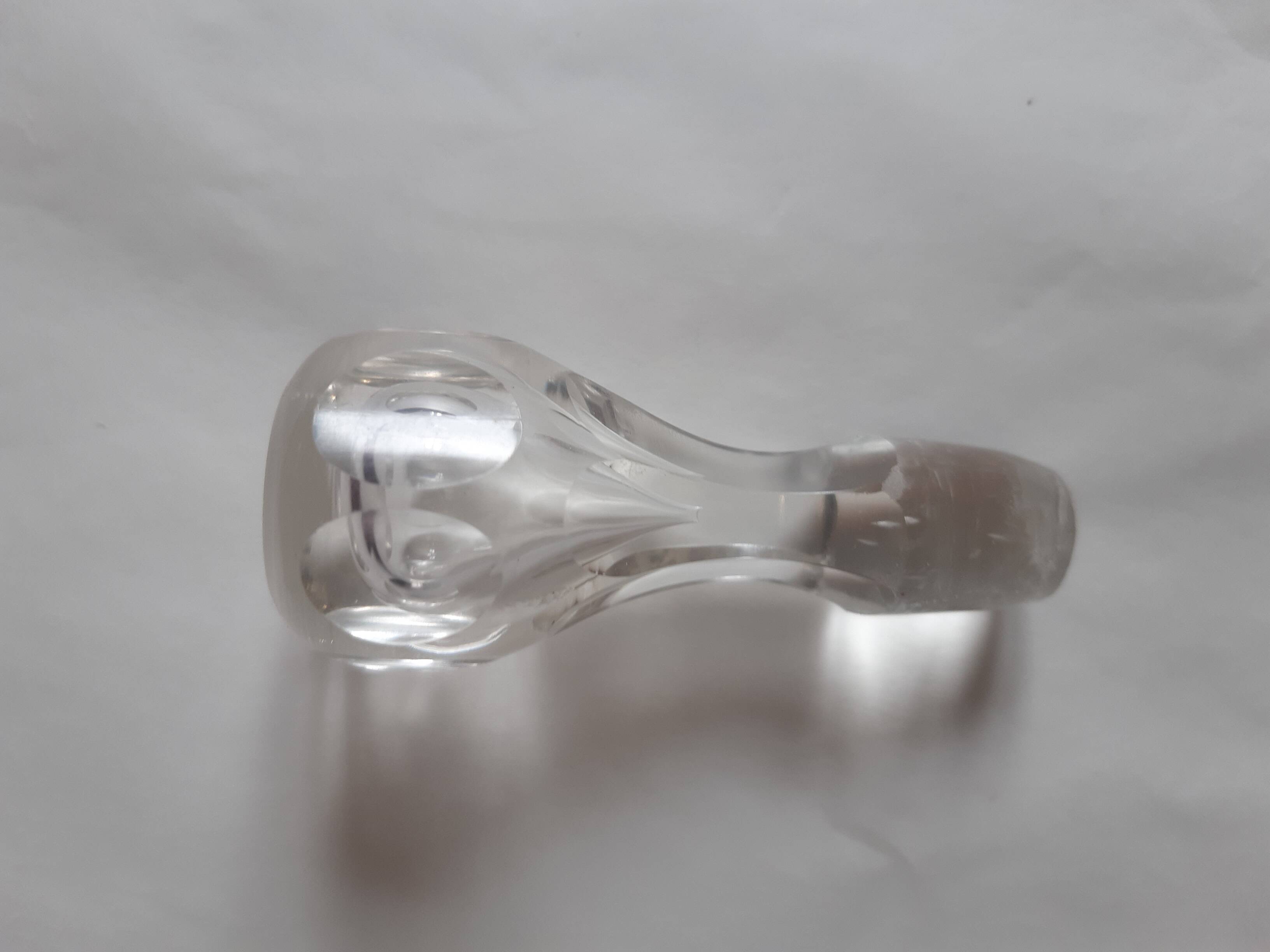 Cut crystal oil bottle with its crystal stopper.