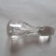 Cut crystal oil bottle with its crystal stopper.