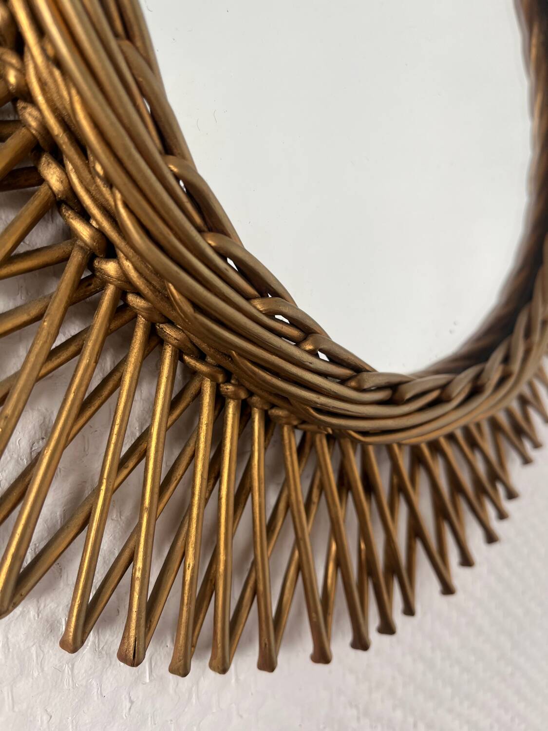 Vintage gold rattan sun mirror