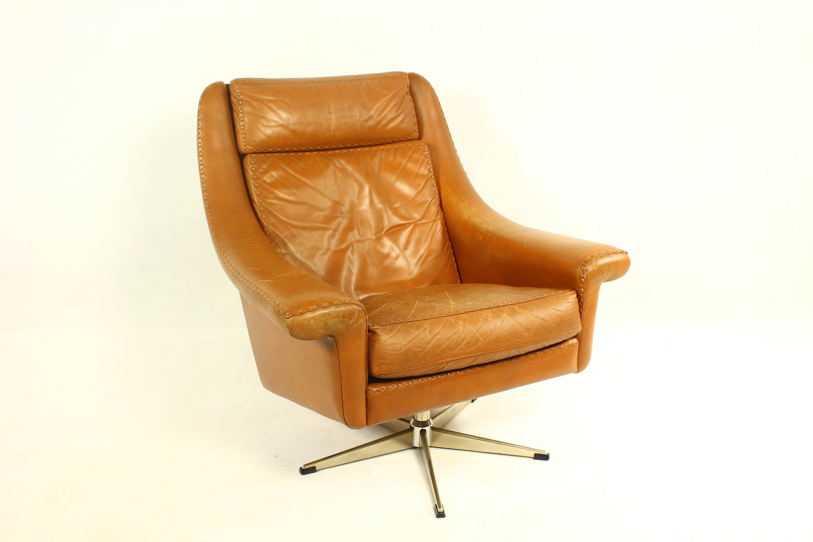 Matador swivel leather chair with ottoman by Aage Christiansen for Erhardsen & Andersen, 1960s
