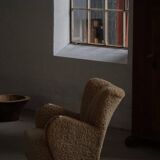 Pair of Danish Art Deco modern lounge chairs in sheepskin with lambswool and elm, 1940s.