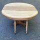 Round dining table with a central pedestal, stripped raw oak, 4 extensions, 19th century.