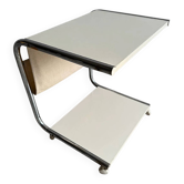 Postmodern side table in white and chrome metal with a beige canvas magazine rack on casters