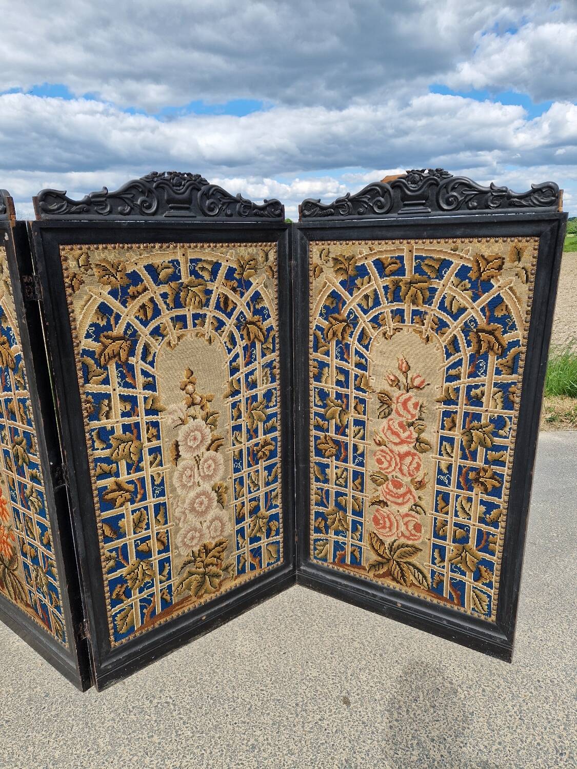 Folding screen in black-painted wood, 19th century