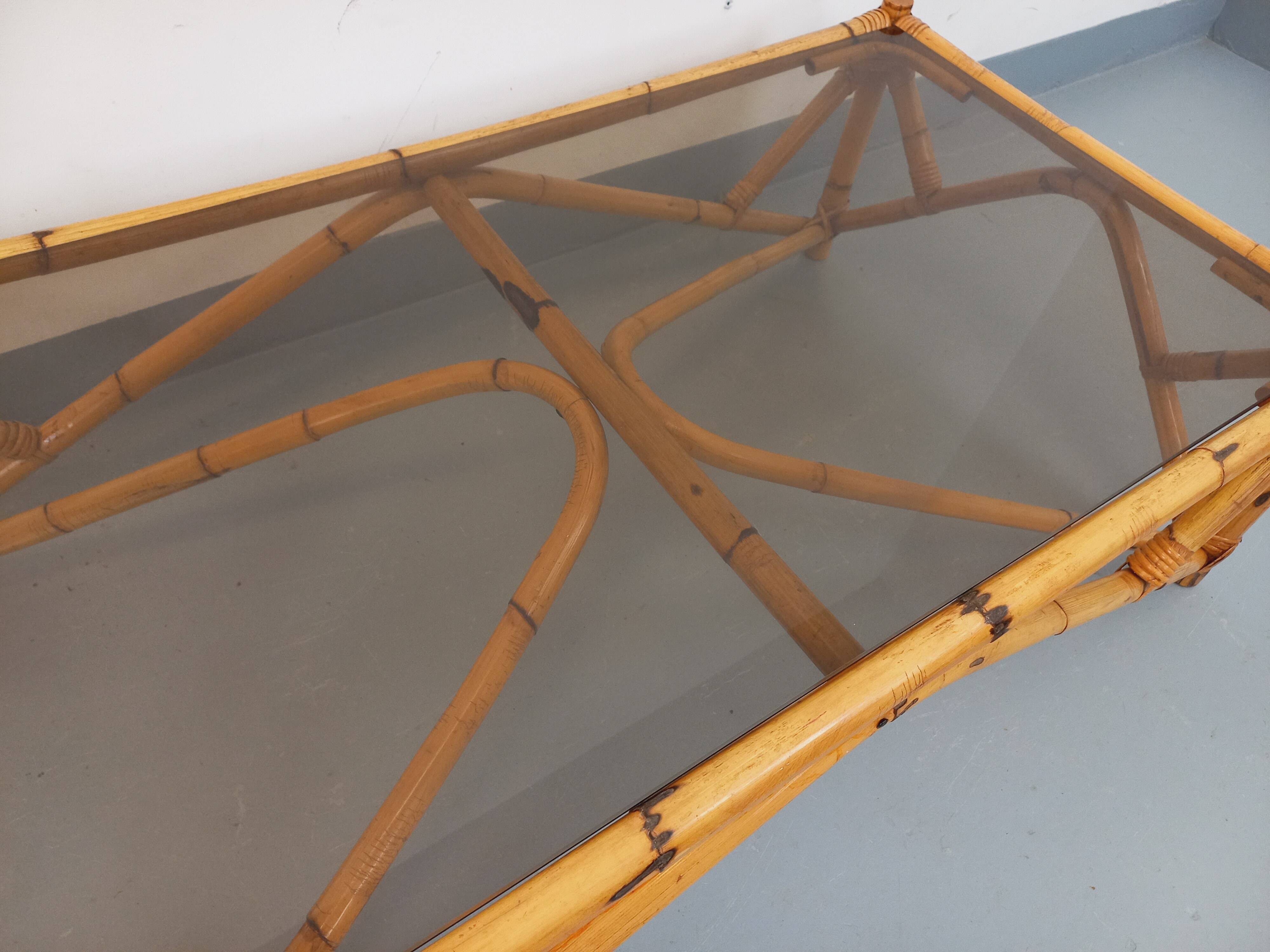 Vintage rectangular coffee table in rattan and smoked glass from the 1970s.