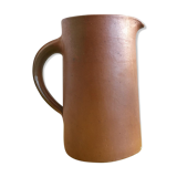 Pitcher in brown sandstone