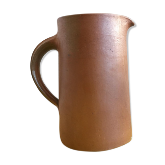 Pitcher in brown sandstone