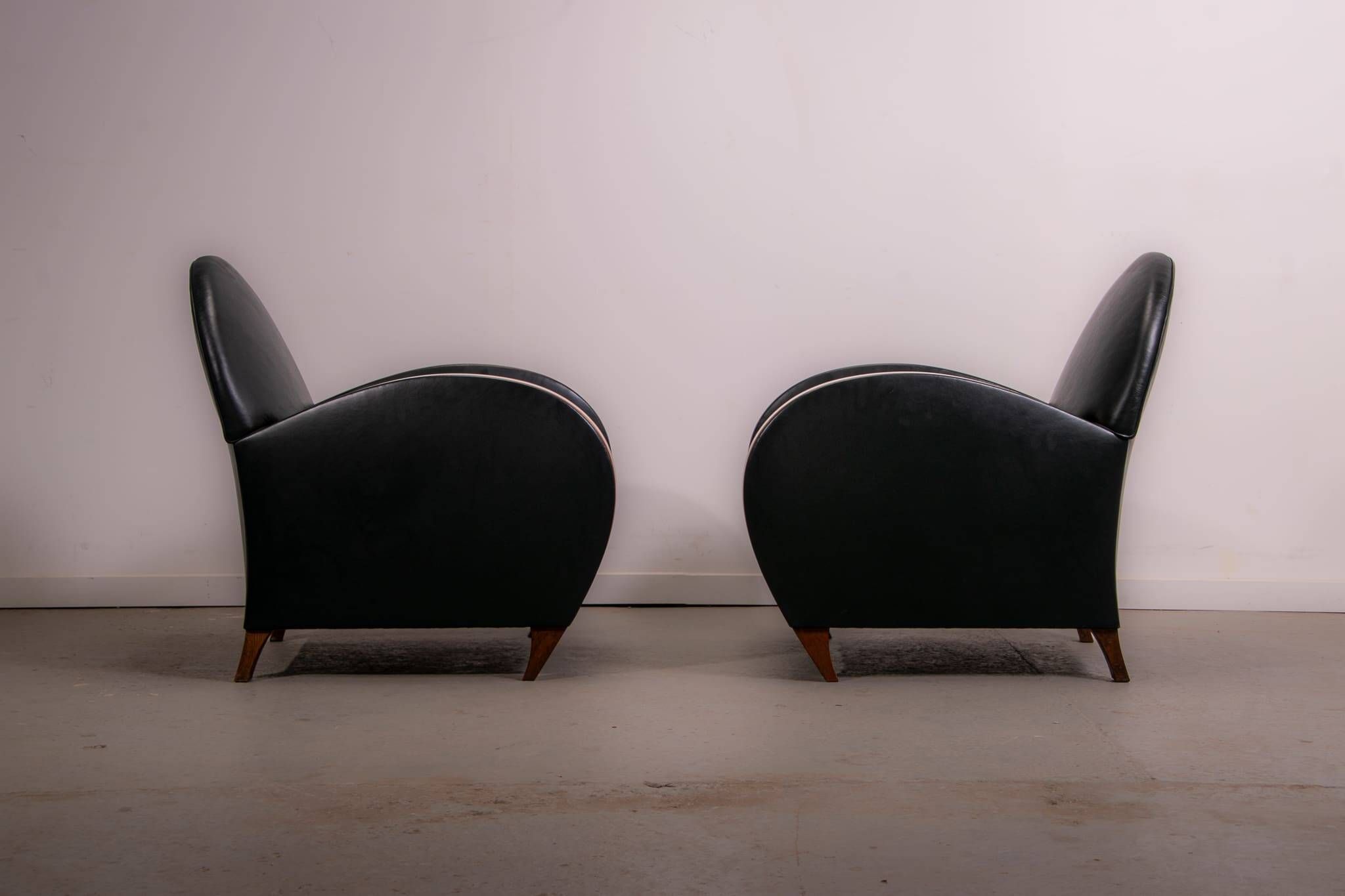 Pair of mid-century leather armchairs, circa 1970, made in Belgium.