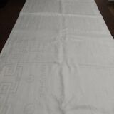 Table napkins set of eleven in a single piece damask linen and silk early 20th century.