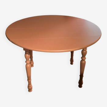 Round wooden table with extensions