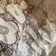 White cotton tablecloth with crochet lace.