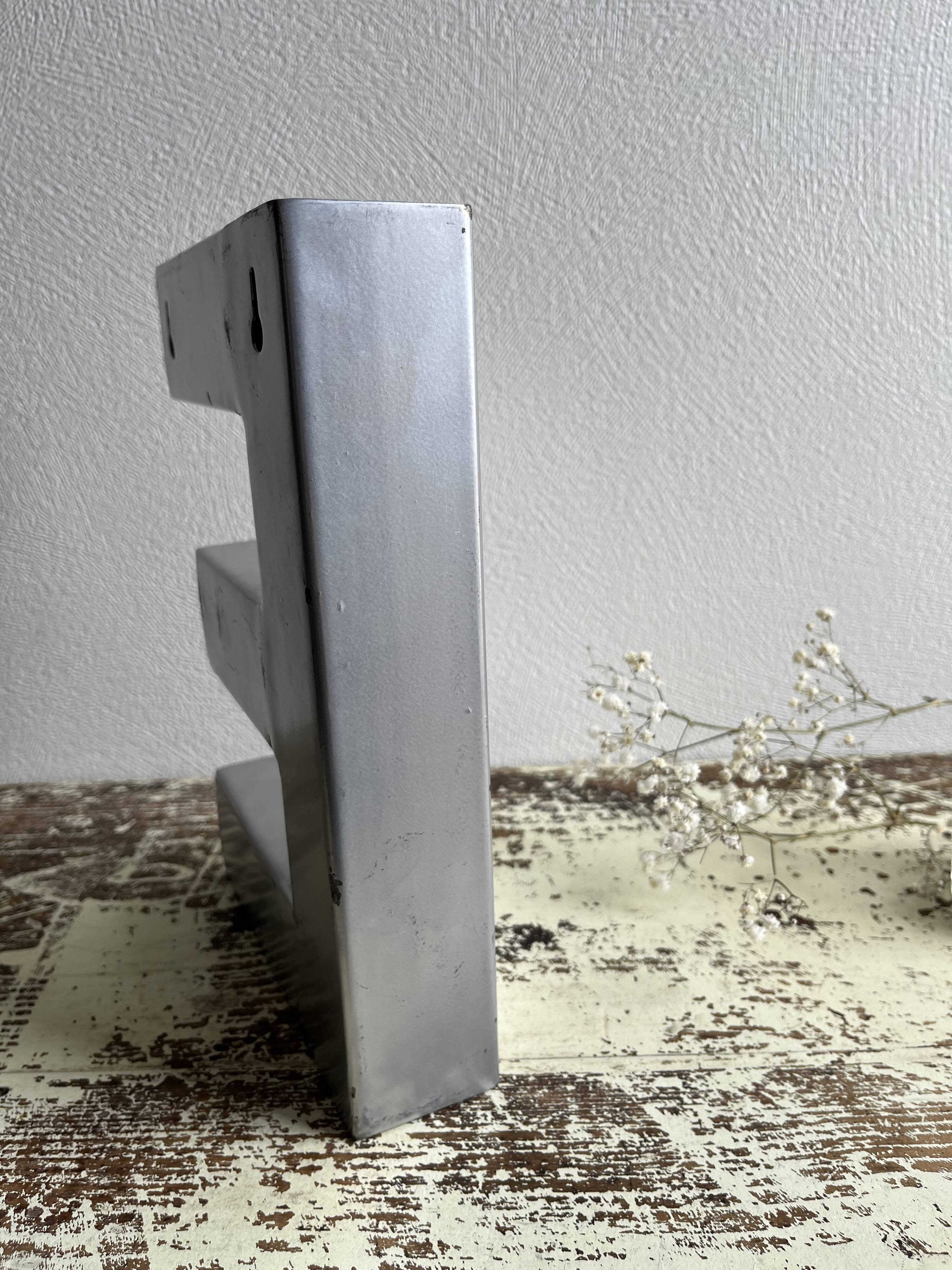 Metal sign letter E
