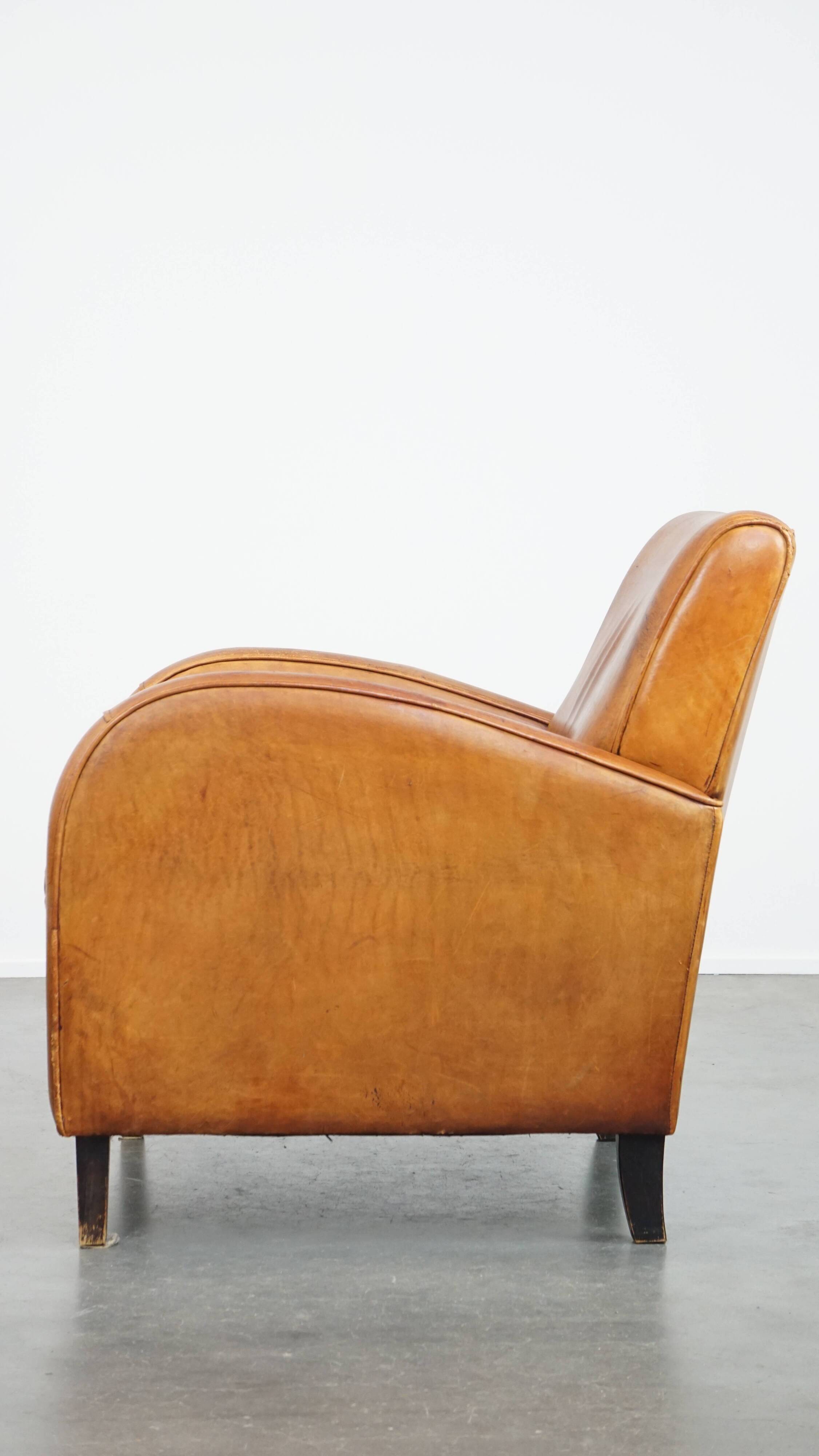 Characteristic sheepskin design armchair in beautiful warm cognac colours
