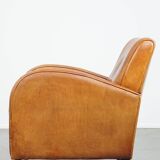 Characteristic sheepskin design armchair in beautiful warm cognac colours