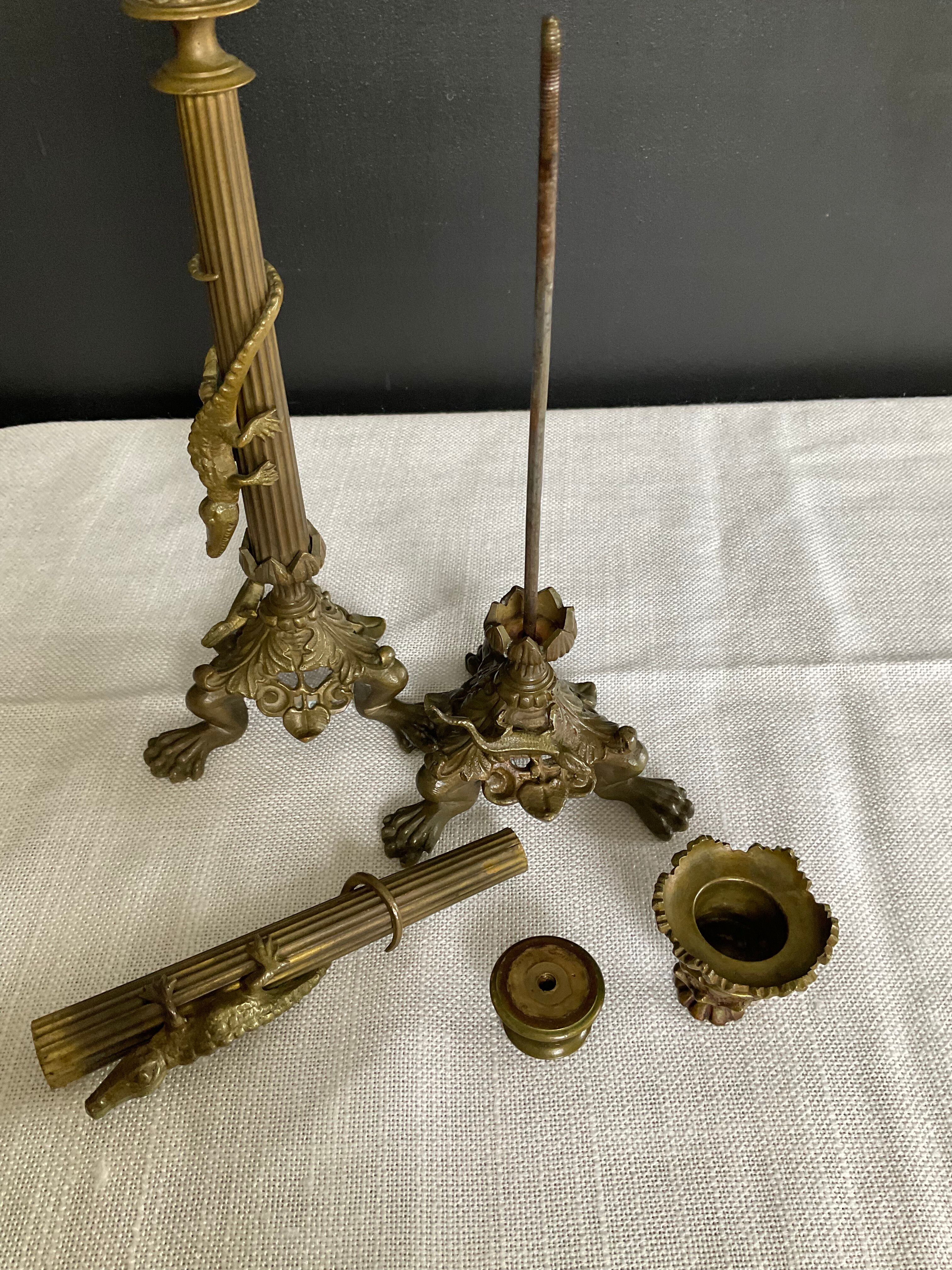 Pair of 19th-century gilded bronze candlesticks in Empire style.