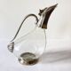 Ewer, decanter in silver-plated metal and glass