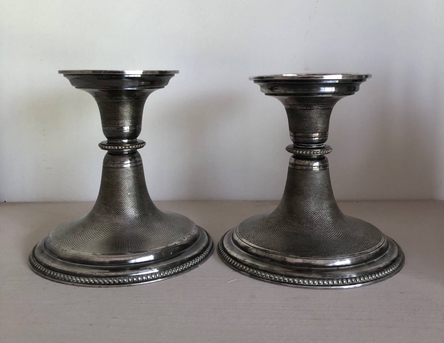 Silver candlesticks by TH HENRY