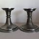 Silver candlesticks by TH HENRY