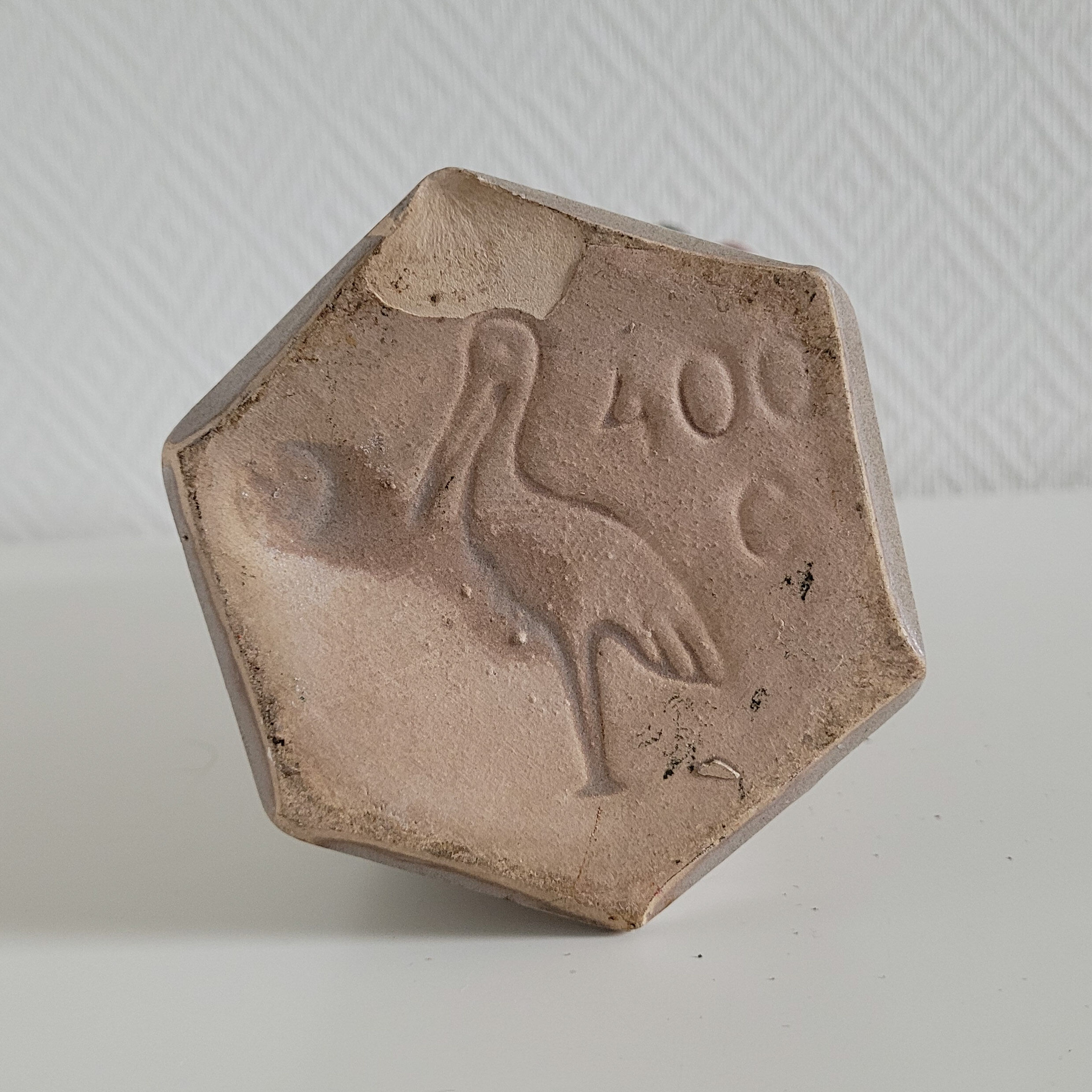 Old hexagonal sandstone bottles