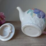 Old ceramic teapot in the shape of a basket of fruits from the garden