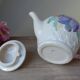 Old ceramic teapot in the shape of a basket of fruits from the garden