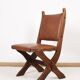 Pair of brutalist style chairs, in wood and leather.