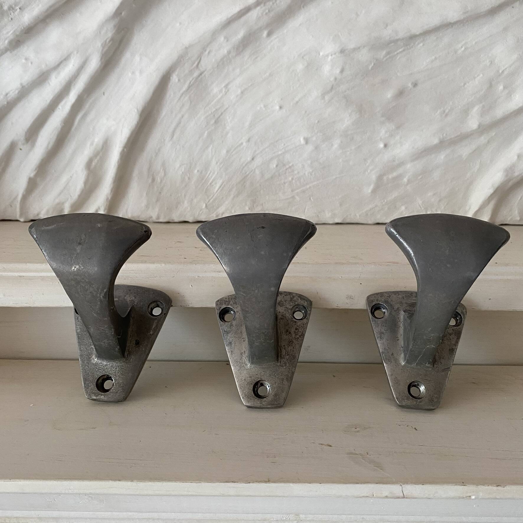 Set of 3 vintage steel hooks from a school.