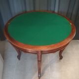 Half-moon mahogany game table on casters