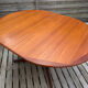 Oval teak table extendable with two leaves, Baumann style.