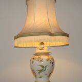 Table lamp with wooden base and fringed shade