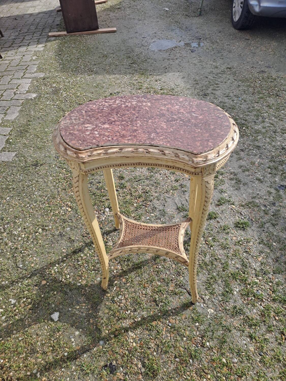 Patinated pedestal table in the transitional style of the 1900s with a marble top. Dimensions