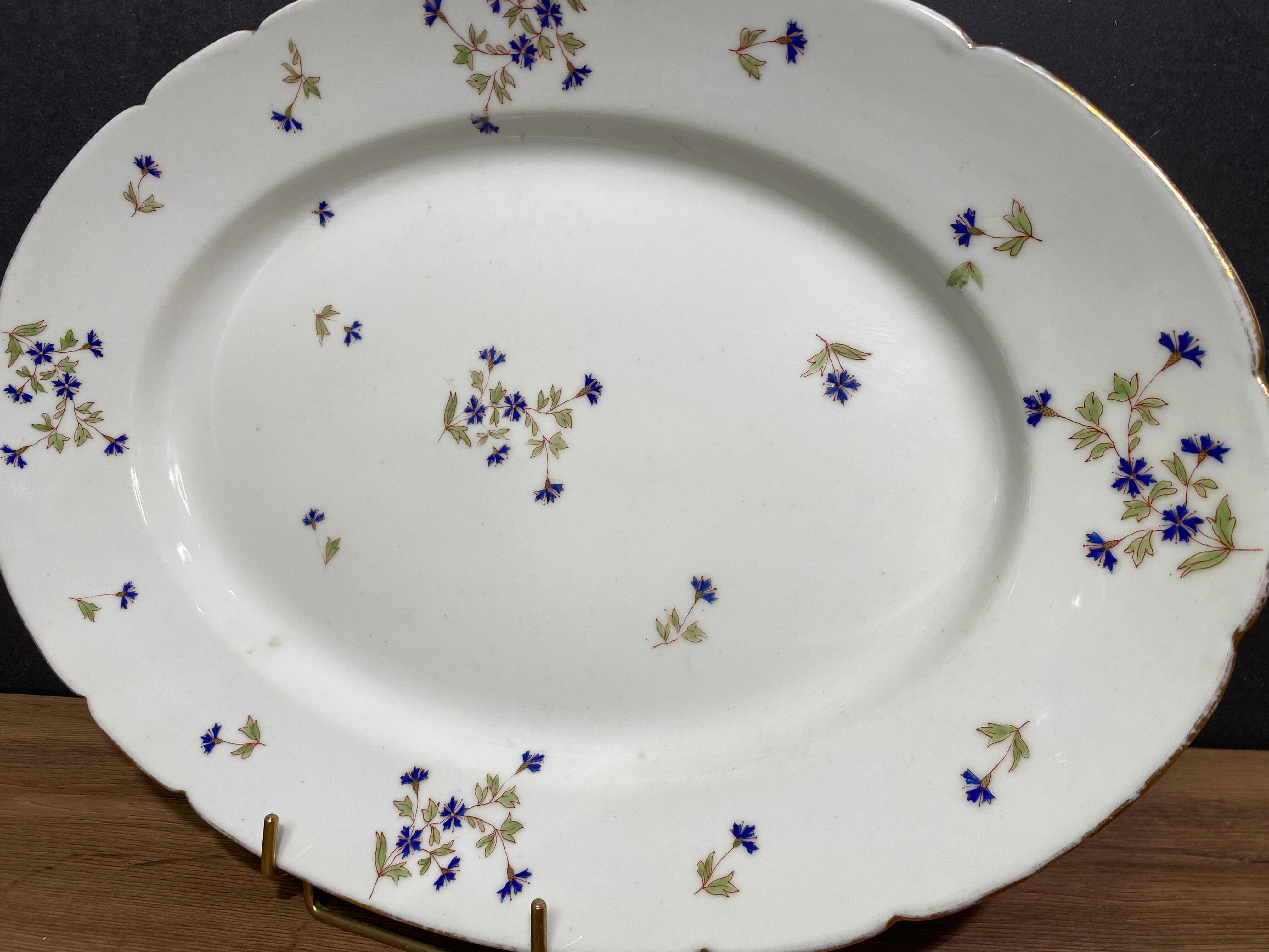 Oval-shaped dish in Limoges porcelain decorated with barbels Louis XV style